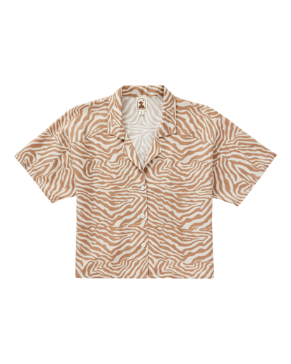The Dandy Del Mar Lucia Top in Cortado Sawla Print is a short-sleeve button-down linen shirt featuring a brown and white zebra pattern, shown laid flat on a white background.