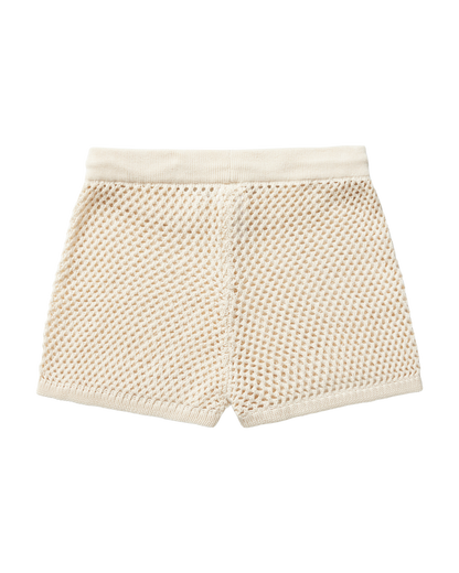 The Málaga Crochet Shorts in Vintage Ivory by Dandy Del Mar feature an elastic waistband and low-rise fit, shown flat on a black background.