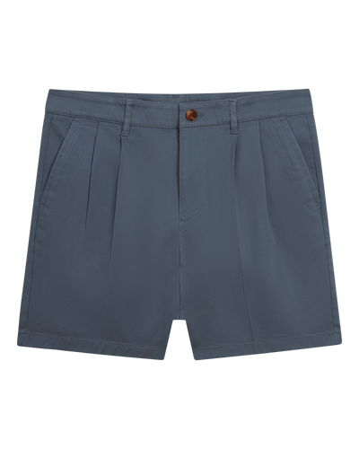 The Rhodes Twill Shorts - Abyss by Dandy Del Mar, crafted from washed blue cotton twill with pleats, belt loops, side pockets, and a front button and zip closure, displayed on a white background.