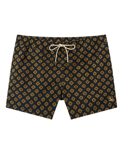 The Ventura Volley Shorts by Dandy Del Mar feature a navy blue base with yellow floral geometric patterns and a white drawstring on the elastic waist, showcased against a plain white background.