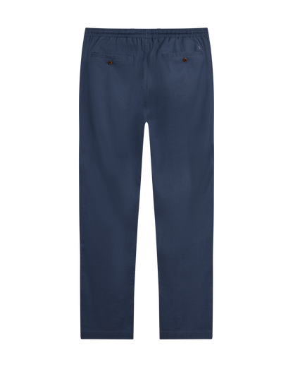 The Brisa Linen Pant - Moontide by Dandy Del Mar, shown from the back with an elastic waistband and two buttoned back pockets—ideal for comfortable vacation wear.