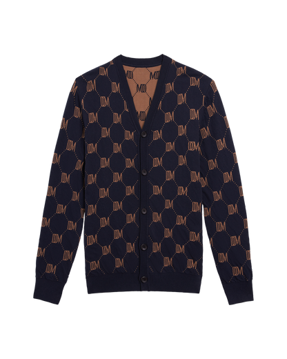 The Castello Cardigan - Abyss by Dandy Del Mar features a navy blue hue, brown geometric pattern with "DM" lettering, DDM Monogram motif, V-neck, and button closure for a refined luxury look.