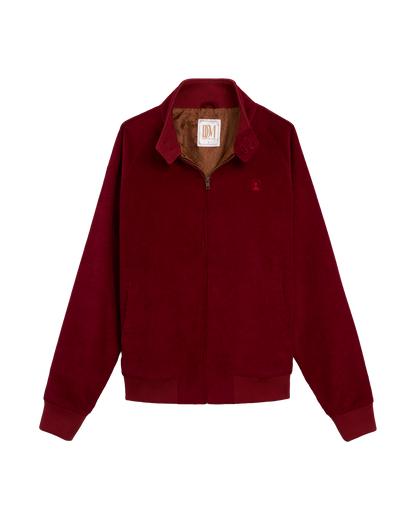 The Corsica Corduroy Jacket - Sangria by Dandy Del Mar, shown laid flat on a white background, features premium Italian corduroy, a zip front, two side pockets, a turn-down collar, and brown lining.