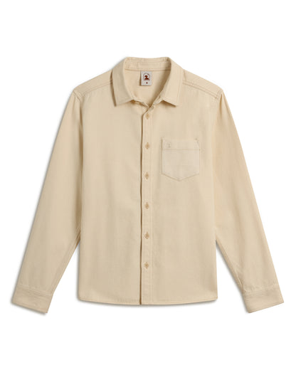 The Cartagena Denim Shirt - Scallop by Dandy Del Mar is a beige long-sleeve button-up with a chest pocket, laid flat.
