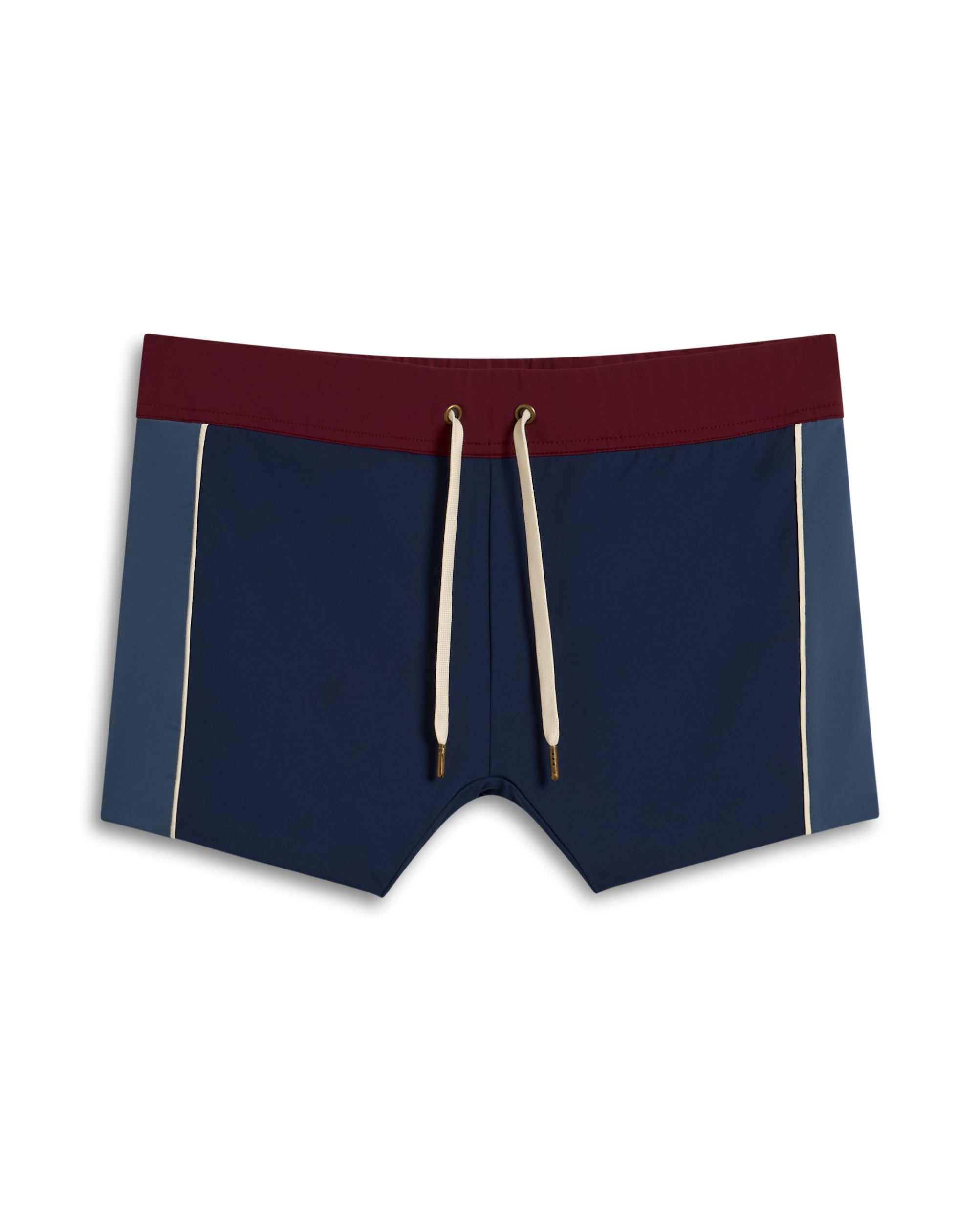 The Cassis Square Cut Swim Brief by Dandy Del Mar boasts recycled polyester construction with an elastic burgundy waistband, navy front, blue side panels, and cream drawstrings for a sustainable European fit.