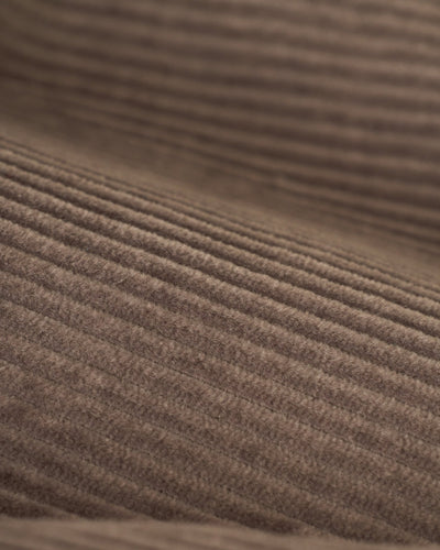 Close-up of The Corsica Corduroy Shorts in Argento by Dandy Del Mar, showcasing the brown corduroy fabric’s texture and parallel ridges.