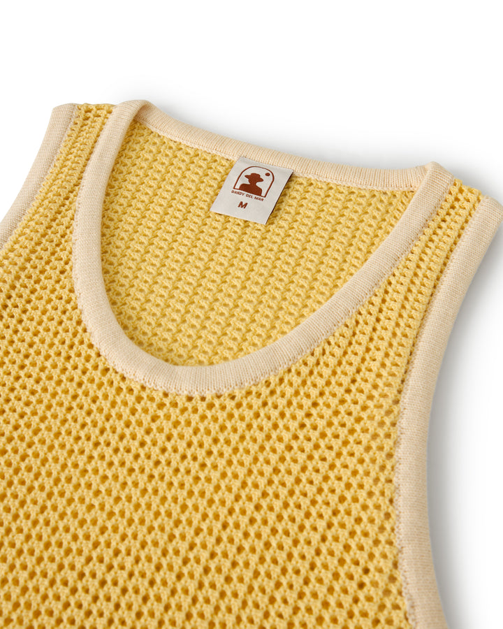 The Dominica Crochet Tank by Dandy Del Mar is a sleeveless, lightweight yellow knit top with a crew neckline, featuring an M size tag inside.