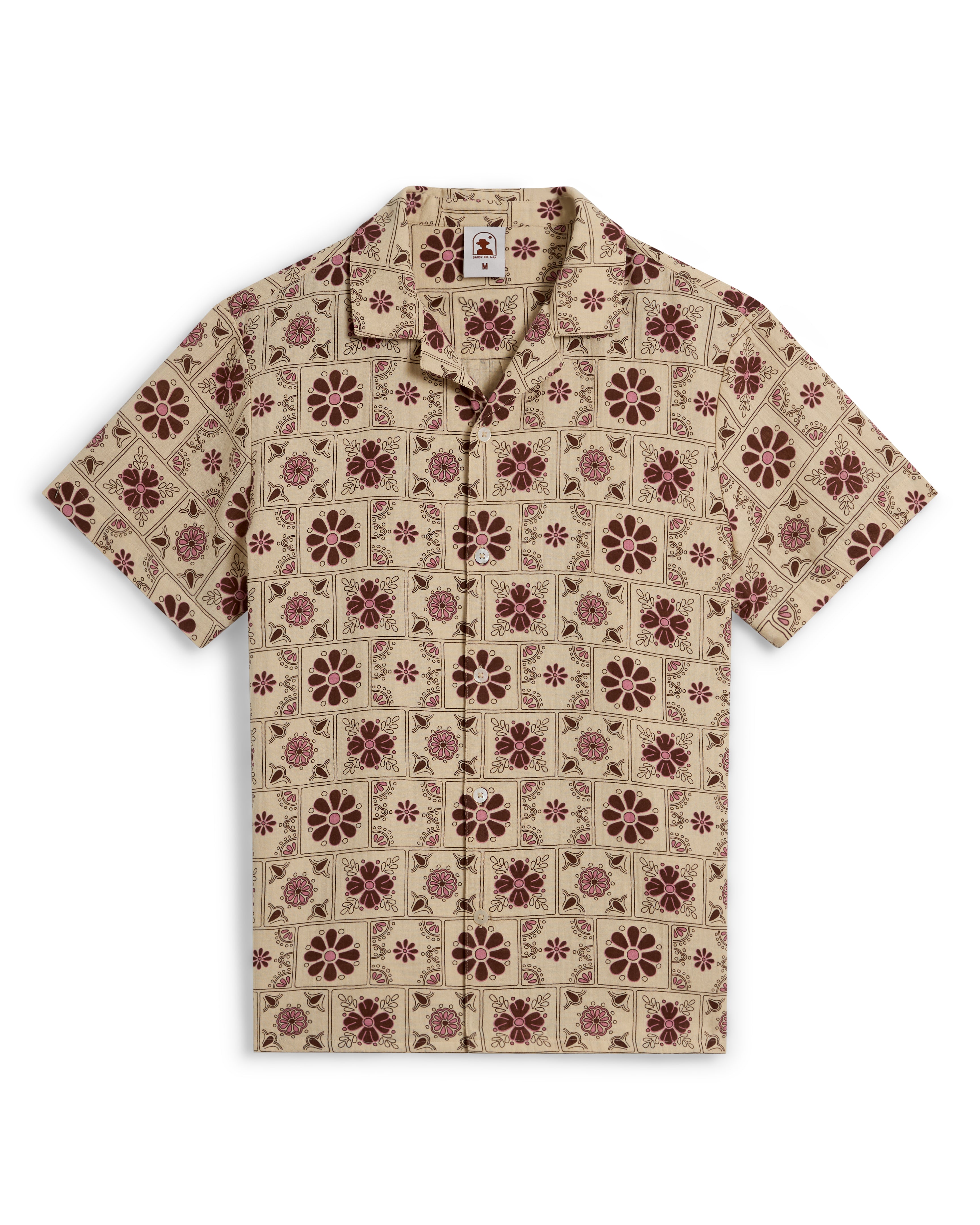 The Dandy Del Mar Grenadine Crinkle Gauze Shirt in Sabbia features a short-sleeve design with a geometric and dark red floral pattern.