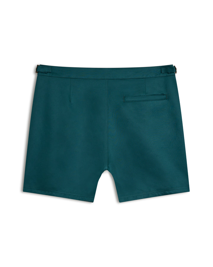 Introducing The Mallorca Swim-Walk Short by Dandy Del Mar: Tempest Blue with a sleek nylon design, featuring a single back pocket and adjustable brass side fasteners for a perfect fit.