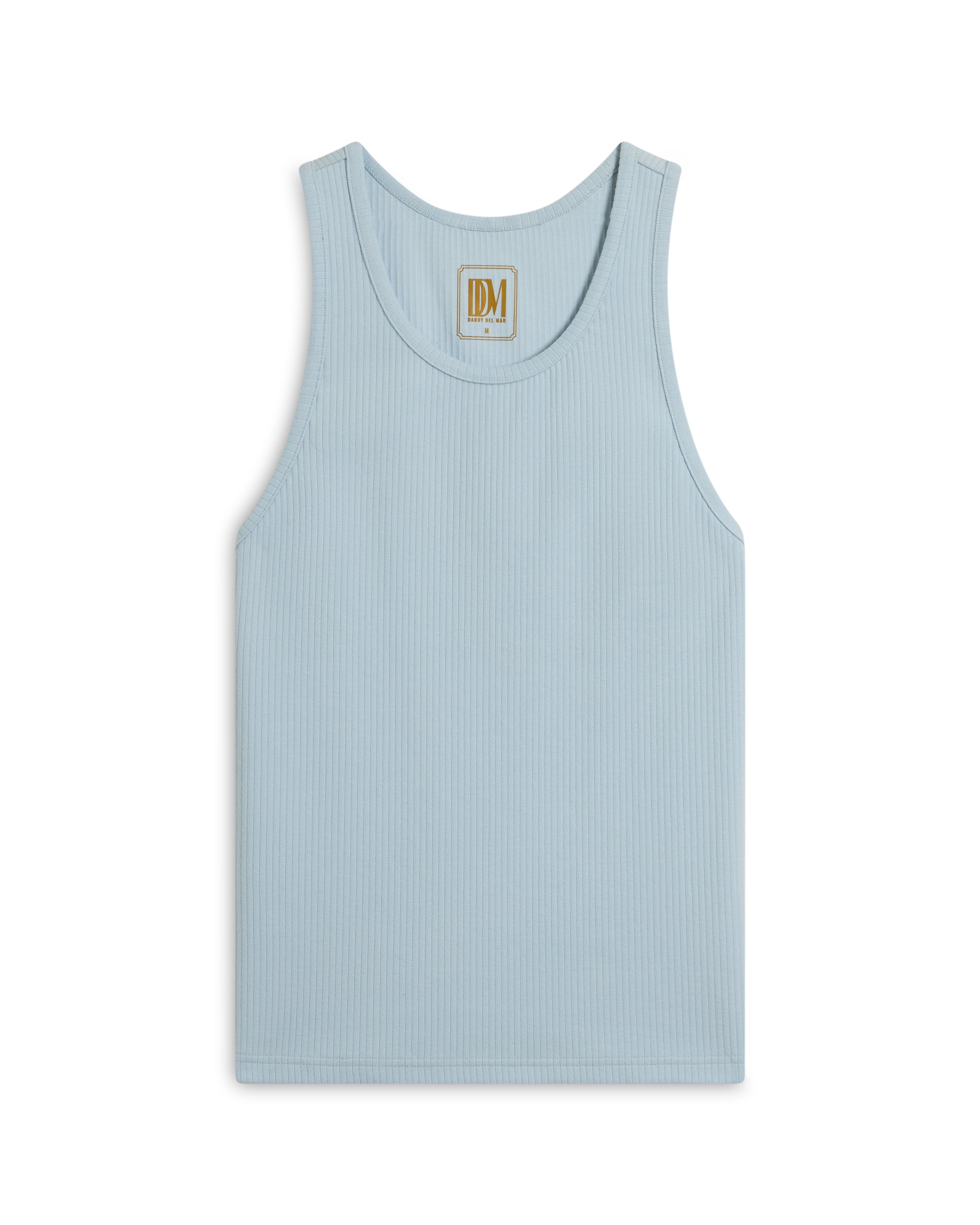 The Milan Rib Tank - Comet by Dandy Del Mar is a light blue, rib knit tank with a scoop neck and a small "DM" label at the neckline, showcased on a white background, expertly merging luxury with simplicity.