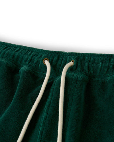 Close-up of the green elastic waistband on The Rio Velour Shorts - Albero by Dandy Del Mar, featuring soft velour fabric and a white drawstring threaded through metal eyelets.