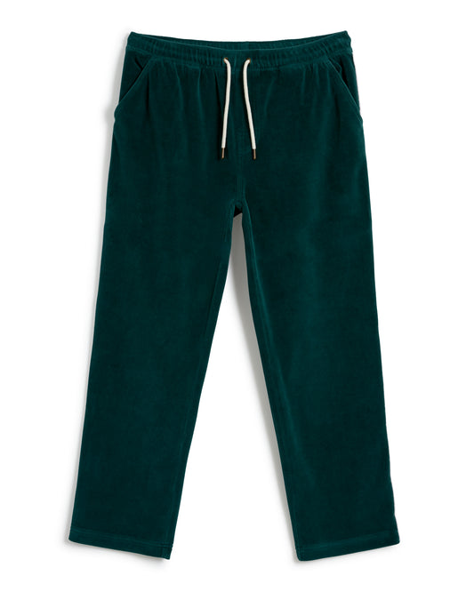 The Rio Velour Pant - Albero by Dandy Del Mar are a pair of green sweatpants with an elastic waistband and white drawstring, featuring side pockets and embodying the essence of athletic leisure.