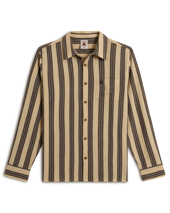 The Santos Shirt - Tierra Weave by Dandy Del Mar is a long-sleeved shirt featuring black and beige vertical stripes, a button front, collar, and a chest pocket on a white background.