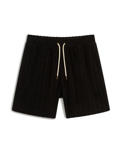 The Tropez Jacquard Short - Onyx by Dandy Del Mar boasts a black pleated design with an elastic waistband, white drawstring, and jacquard striped terry cloth for added style.