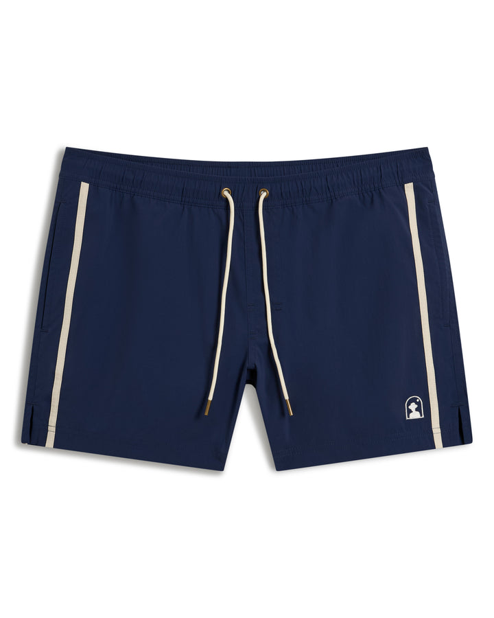 The Ventura Volley Short - Anchor by Dandy Del Mar are navy blue swim shorts with a micro mesh liner, white side stripes, an elastic waistband, and drawstrings.