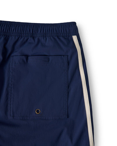 Close-up of The Ventura Volley Shorts - Anchor by Dandy Del Mar, featuring an elastic waistband, back pocket with metal grommet, and white side stripe—crafted for stylish men's swimwear.