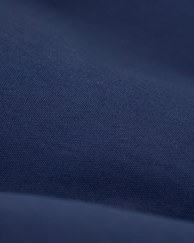 Close-up of a dark blue fabric with a fine, even weave and soft folds, highlighting the premium material of Dandy Del Mar’s Ventura Volley Shorts - Anchor.