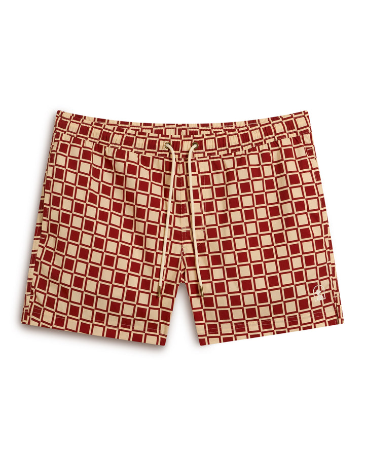 The Ventura Volley Short - Rouge from Dandy Del Mar are red and beige checkered swim trunks featuring an elastic waistband and drawstring.