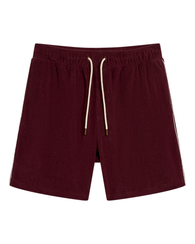 The Gaucho Terry Cloth Shorts in Bordeaux by Dandy Del Mar feature an elastic waistband, white drawstring, and side pockets, shown on a white background.
