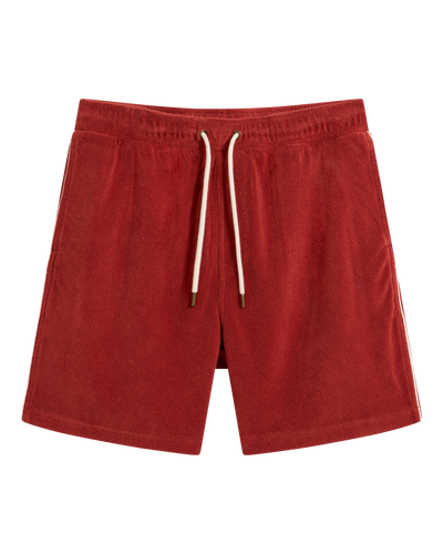 The Gaucho Terry Cloth Shorts - Rouge by Dandy Del Mar feature an elastic waistband, drawstring tie, and side pockets in red terry cloth, shown on a white background.