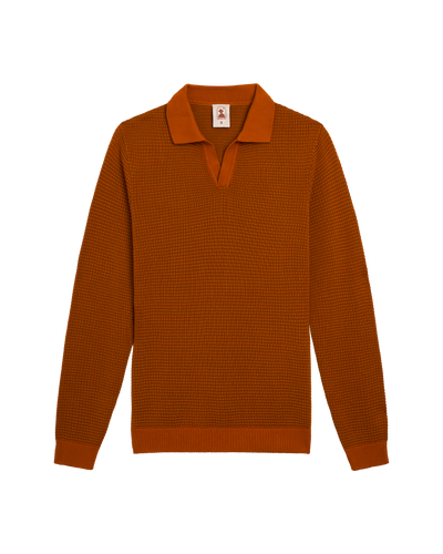 The Sebastian LS Polo Shirt in Burnt Sienna by Dandy Del Mar: a rust-colored, long-sleeve cotton polo with a textured sweater knit and open collar, shown laid flat on a white background.