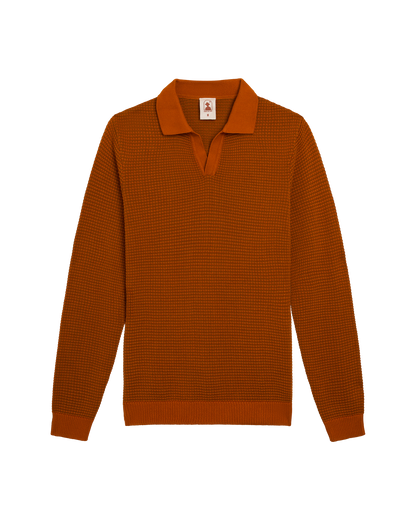 The Sebastian Long Sleeve Polo in Burnt Sienna by Dandy Del Mar: a 100% cotton knit sweater with a textured pattern, open collar, and ribbed cuffs and hem, shown laid flat on a white background.