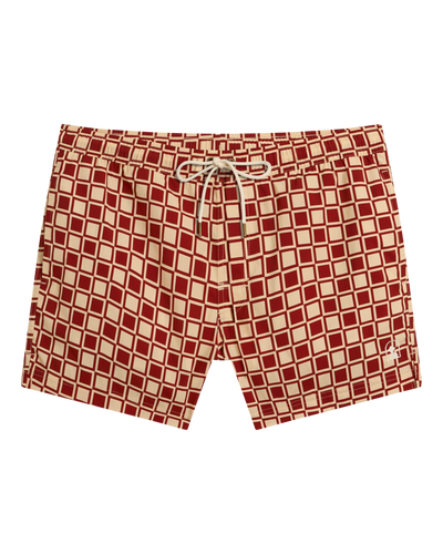 The Ventura Volley Shorts - Rouge by Dandy Del Mar: red and beige men's swim trunks with a white drawstring, elastic waist, and geometric square pattern, shown flat on a white background.