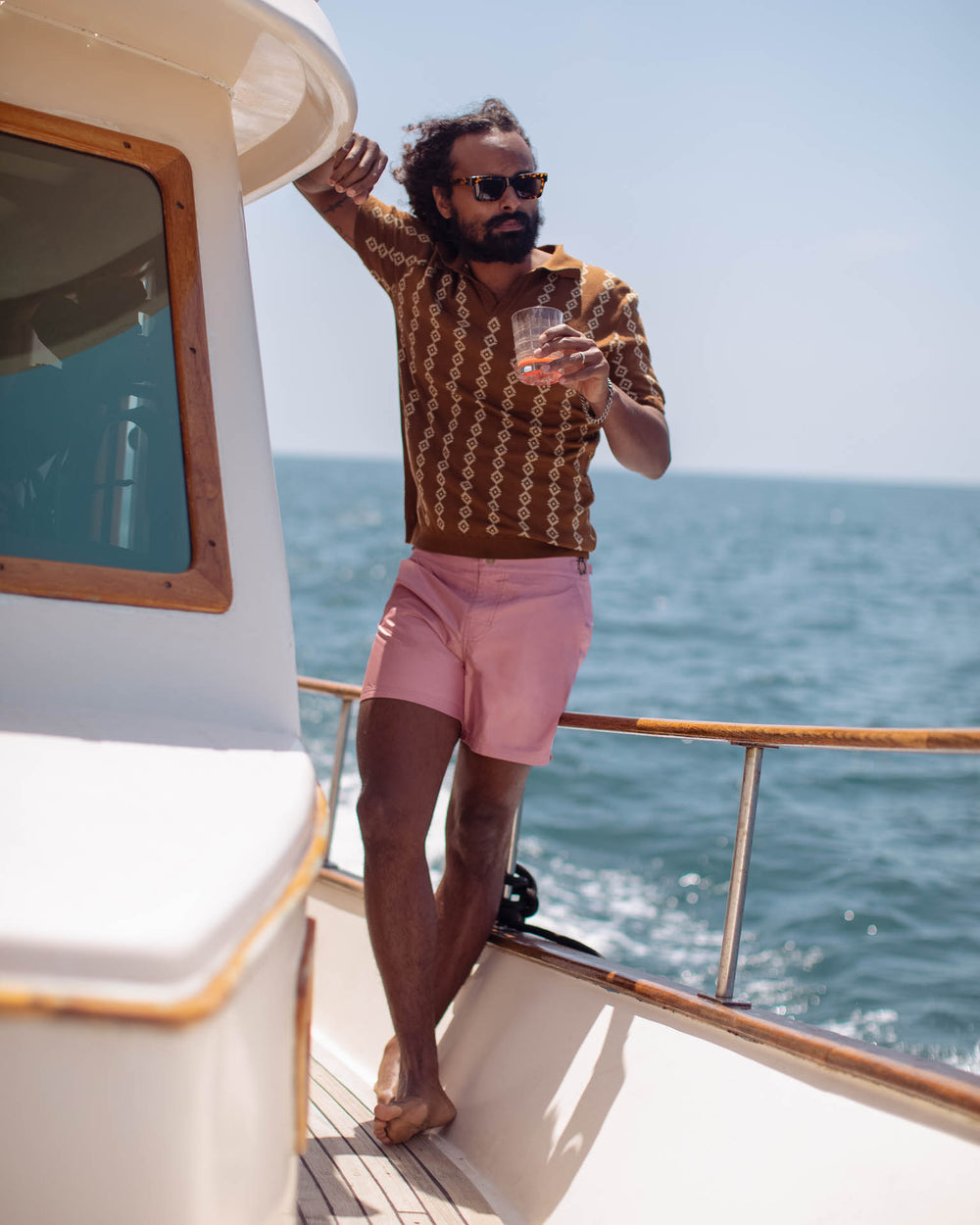 man standing on the boat has wearing dandy del clothes