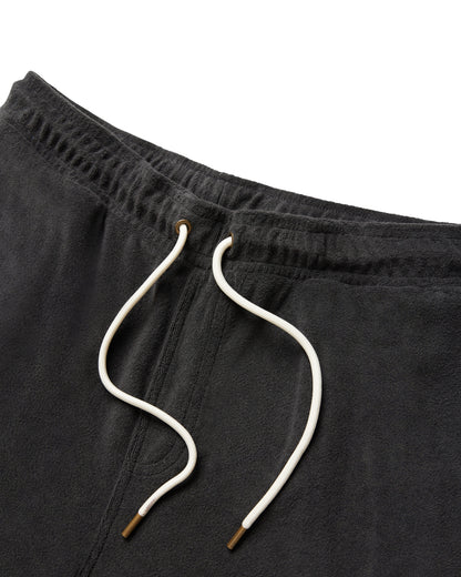 Close-up of The Gaucho Shorts - Onyx by Dandy Del Mar, featuring a dark gray terry cloth texture, white drawstrings with metallic tips, and detailed waistband design.